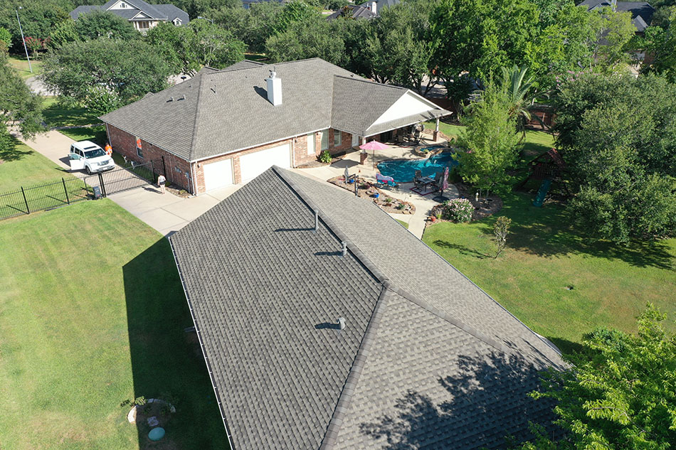 Completed asphalt shingle roof installation by Lone Star Roofing - Project 4