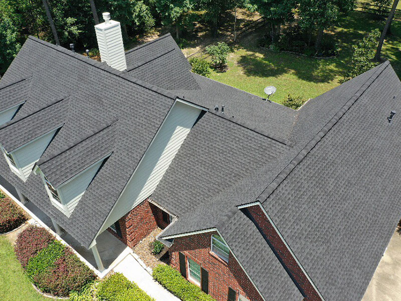 Lone Star Roofing team at a completed residential roofing project in Houston TX